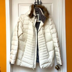 White winter jacket. Good for snow and cold weather. Be ready for next winter!